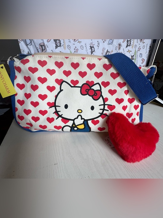 Hello Kitty Handbags - Hello Kitty Canvas Crossbody Bag in Red, Blue, Cream with Plush Red Heart Charm